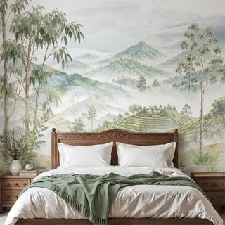 The Nilgiri luxury scenic mountain wallpaper mural installed behind a beige upholstered bed in a serene master bedroom layout.