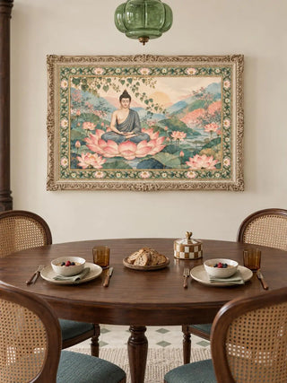 Nirvana Bloom landscape wall art in a carved cream frame hanging above a round wooden dining table, cane-back chairs and a green glass pendant light.