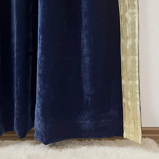 Bottom view of Nizam Blue Gold Curtain highlighting its soft velvet drape and gold trim detail against a light rug flooring.
