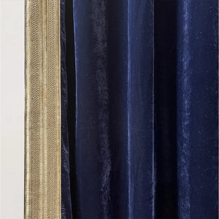 Close-up of Nizam Blue Gold Curtain showing its deep blue velvet texture with shimmering gold border for a luxurious yet understated finish.