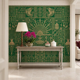The Nizam wallpaper in emerald green in an entryway behind a carved grey console with a pleated lamp and pink orchids view-foyer
