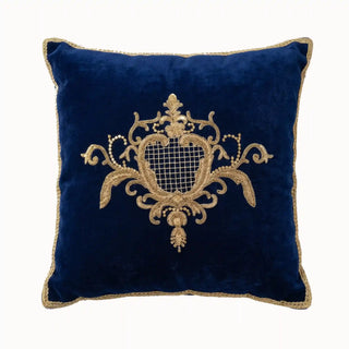 A front view of the Nizam cushion featuring intricate gold Zardosi embroidery on a royal blue velvet base.