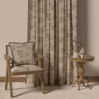 The Nritya Fringes curtain displayed in a room setting with furniture, demonstrating its full length and tranquil appearance.
