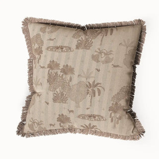 Nritya Fringes cushion cover featuring a subtle, single-tone nature-inspired pattern with trees and animals on a beige background, finished with a matching fringed edge.