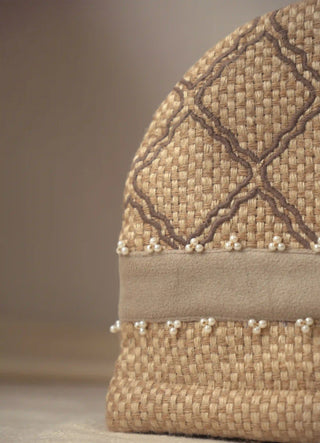 Close-up of the Oat Pearl tea cosy: basket-weave jute, diamond cord embroidery and a seed-pearl band