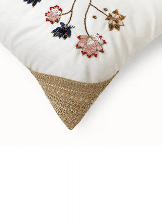 Close-up of Padma Katha sequin lotus blooms in blush, navy and gold with red bead edging and gold cord corner
