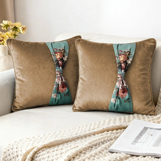 Two Florid Belle Knot Cushions styled on a white sofa with a knitted throw.