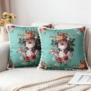 Two Florid Rosette Cushion Covers styled on a white sofa with a knitted throw.