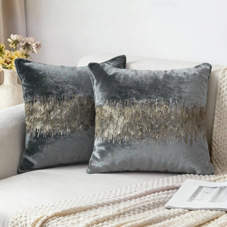 Two Golden Pulse Cushion Covers styled on a white sofa with a knitted throw.