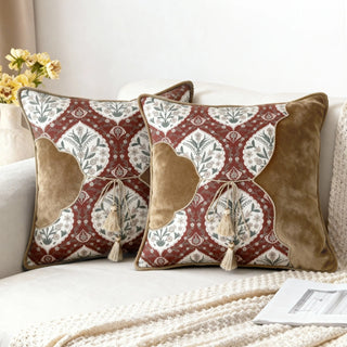 Two Heritage Tie Cushions styled on a white sofa with a creamy throw blanket.