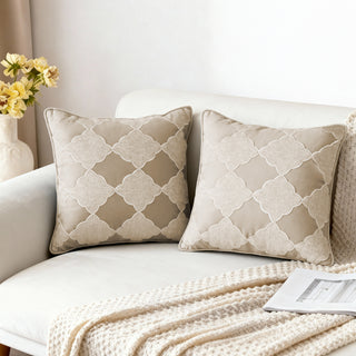 Two Moroccan Lattice Cushion Covers styled on a white sofa with a knitted throw.