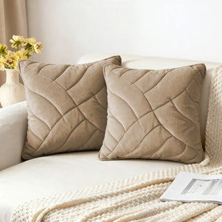 Two Velvet Dune Quilted Cushion Covers styled on a white sofa with a throw.