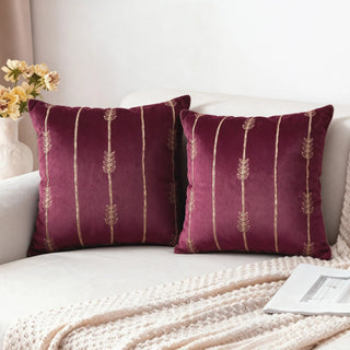 Two Zahra Vine Cushion Covers styled on a white sofa with a knitted throw.