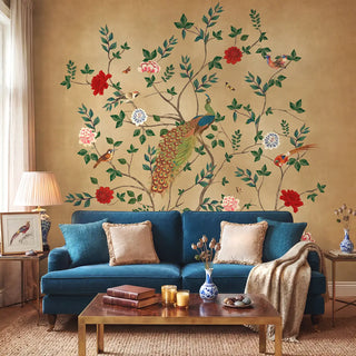 A luxury living room featuring the Pakhi mural behind a sapphire blue velvet sofa with gold accents view-livingroom