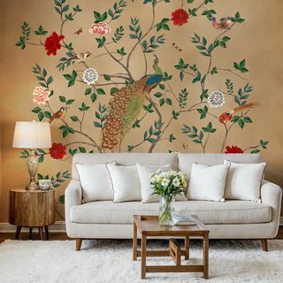 Pakhi Chinoiserie Design Customised Wallpaper featuring a vibrant peacock, birds, and flowering branches on an arched wall above a sofa
