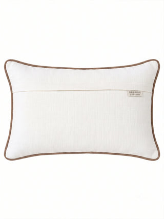 The reverse of the Palm cushion cover in plain ivory with an overlap closure, brown piping and a Prasanaakshi by Life n Colors label