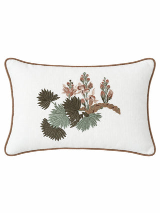 The Palm embroidered cushion cover showing olive and sage fan palm leaves beside rose and blush blossoms on an ivory ground with brown piping