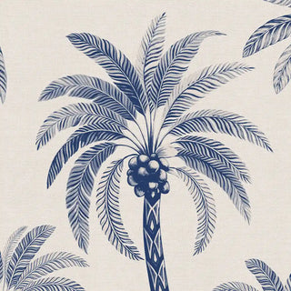 A detailed close-up of the Palmyra Breeze wallpaper in Cyanotype showing a palm crown with coconuts and a patterned trunk in navy and white.