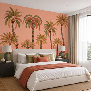 The Palmyra Breeze wallpaper mural in Peach on a bedroom feature wall, showing patterned-trunk palms with coconuts on a coral-peach ground. view-bedroom