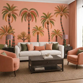 The Palmyra Breeze wallpaper mural in Peach covering a feature wall in a living room behind a cream sofa and coral armchairs. view-livingroom