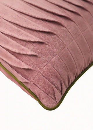 Close-up of the Petal Cascade cushion cover in dusty rose, showing layered fanned pleats, a stitched grid and olive green piping.