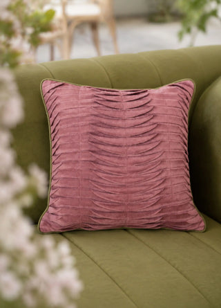 The Petal Cascade cushion cover in Rosewood & Olive styled on an olive-green sofa.