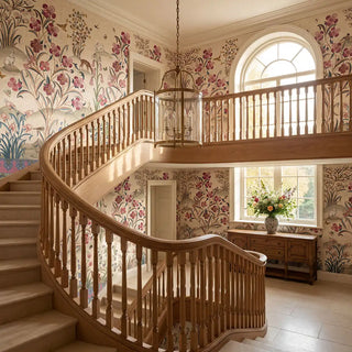 The Petals of Persia luxury heritage botanical wallpaper mural installed across a grand double-height staircase hall with winding oak railings.
