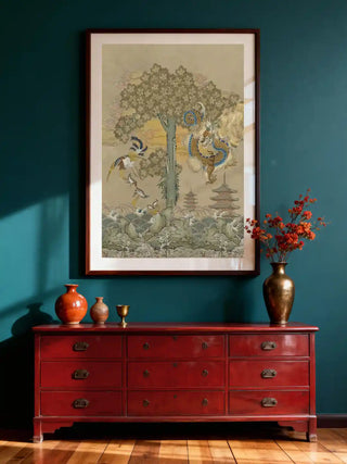 Phoenix chinoiserie wall art in antique sage, framed in dark wood on a teal wall above a red lacquer dresser with brass and terracotta vessels in a hallway.