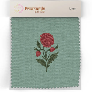 Fabric swatch of Phool Bagh Upholstery Fabric showcasing green linen with detailed red flower embroidery.