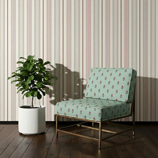 Phool Bagh Sofa and Chair Upholstery Fabric in pastel green with red floral motifs, styled on a lounge chair.