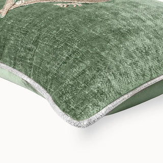 The reverse side of the pistachio velvet cushion showing the concealed zipper and brand label.