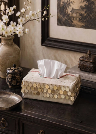 The Pitara tissue case in Oatmeal, view-dresser beside a Chinoiserie print and ceramic jar.