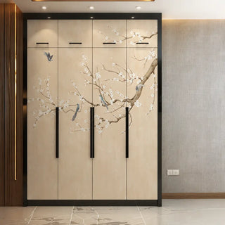 The Plum Blossom Beige custom wallpaper mural wrapped seamlessly across four wardrobe doors with long black handles in a modern bedroom.