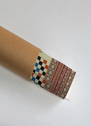 Poetry Modern  wall art poster partially unrolled from its kraft paper tube showing checkerboard grid and floral border.