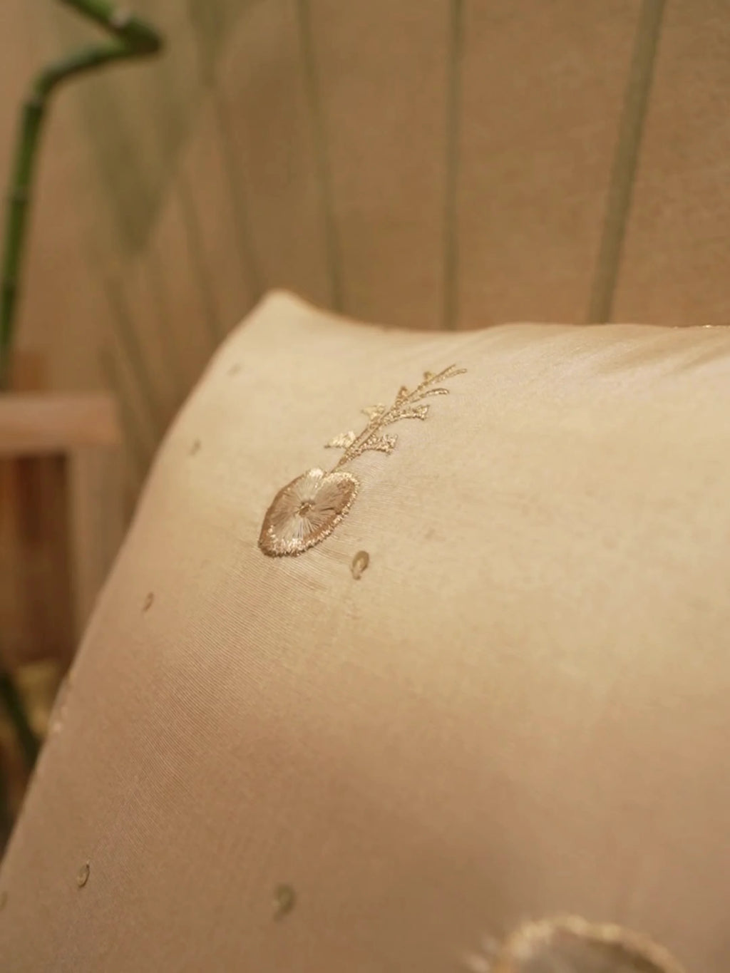 Hiranya Silk Embroidered cushion cover in gold silk with tonal floral sprig embroidery and fine gold piping, shown up close and in full