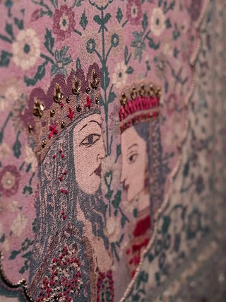 Kashmiriyat embroidered wall art in dusty rose and sage: crowned royal figures, dense floral vines and a paisley-framed central medallion