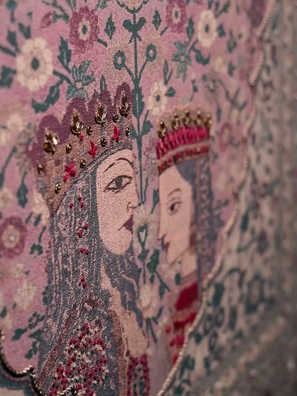 Kashmiriyat embroidered wall art in dusty rose and sage: crowned royal figures, dense floral vines and a paisley-framed central medallion