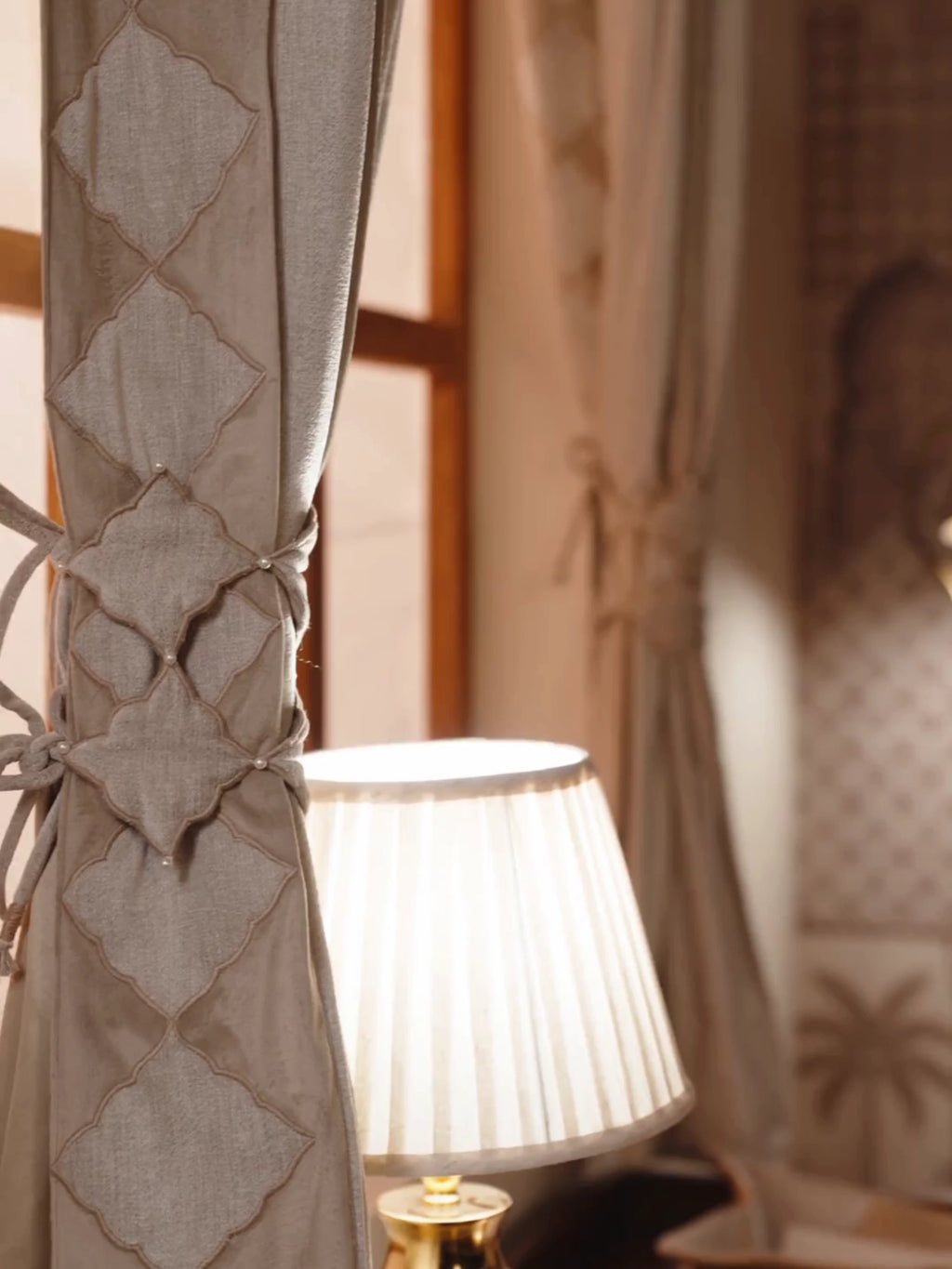 Marrakesh Moti curtain tieback in dove grey with lattice panels and pearl accents, gathering a curtain and adjusted by hand