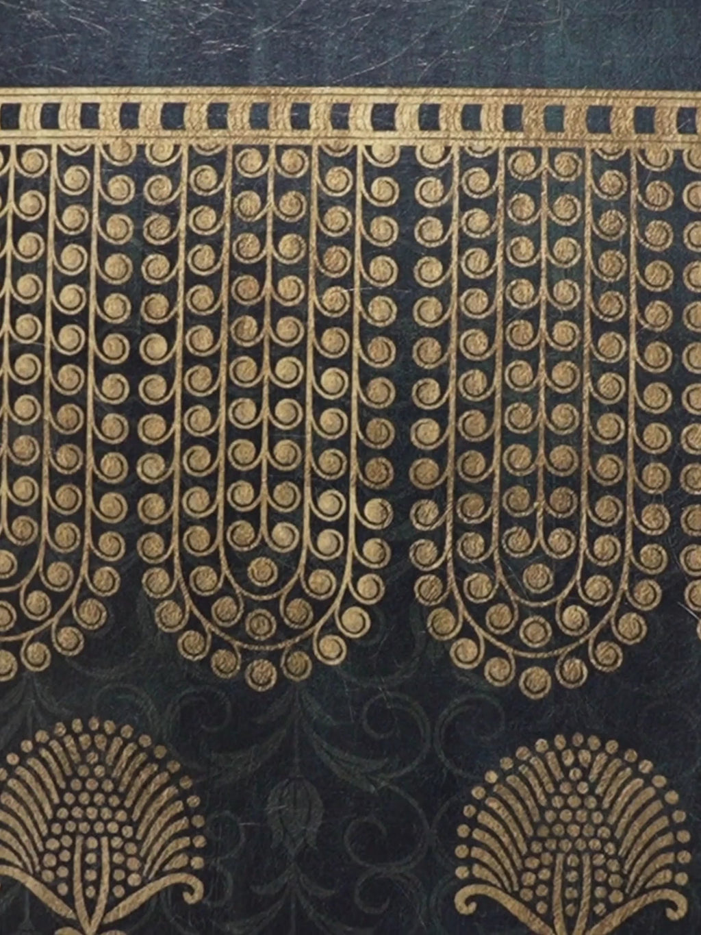 Close-up video of the Midnight Crest wall art in midnight blue and ochre, showing the gold fringe border, peacock motif and scattered butta