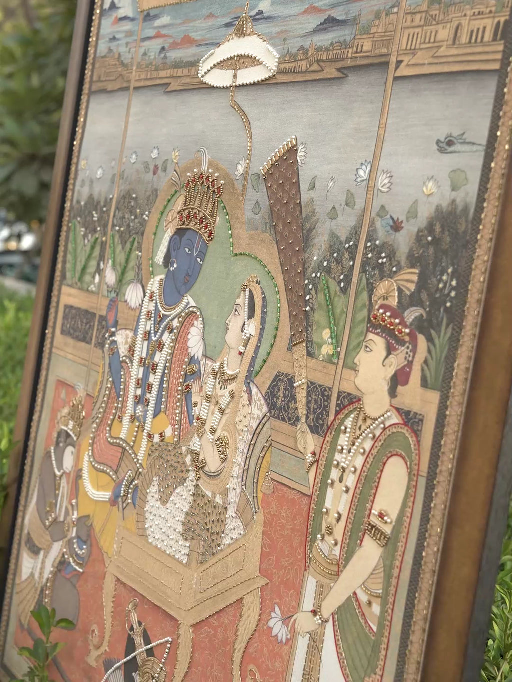 Ram Darbar embroidered wall art: Lord Rama and Sita in court beneath a canopy, with close-ups of Rama's blue face, crown and pearl work