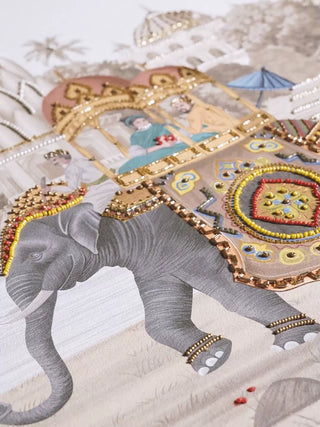 Safar embroidered wall art video: an adorned elephant carrying royalty, an artisan hand-stitching the ivory panel, and a beaded peacock