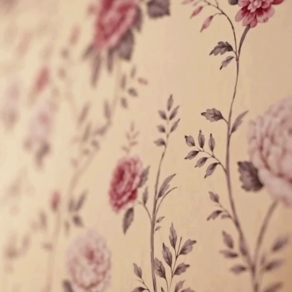 The Rose Heritage English floral wallpaper: pink roses on trailing stems, then the papered wall with a clock, lamp and console
