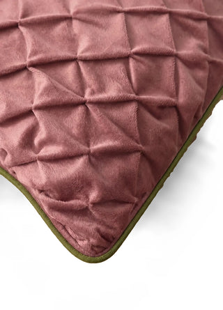 A close-up of the Prism Lattice cushion cover's corner in Rosewood & Olive, showing the diamond pintuck texture and olive piping.