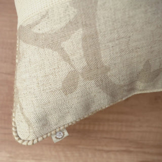 A high-resolution close-up of the ivory open-mesh central panel and whipstitched piping edge of the Prose Pattern cushion cover.