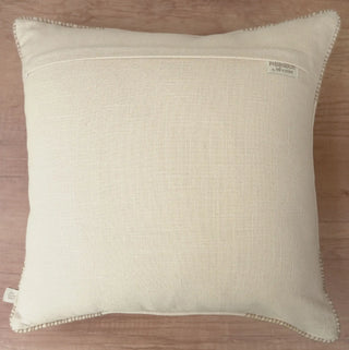 The reverse side view of the Prose Pattern cushion cover showing the clean fabric backing, hidden zipper closure, and brand woven tag.