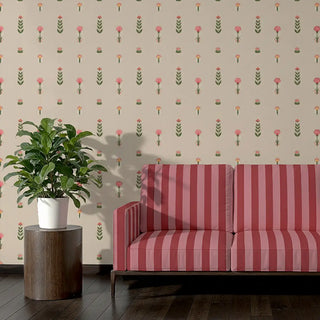 Sofa upholstered in Raga Lines Fabric featuring vertical red and pink stripes against a floral wallpaper.