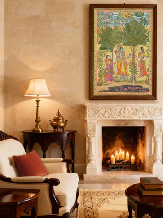 A framed Raga Rama miniature painting styled above a white carved fireplace with candles and a leather armchair.