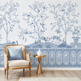 Raj Bagh Wallpaper: Full mural installation of the blue and white Indian-style garden scene with trees, birds, and ornamental lower border in a sitting area.