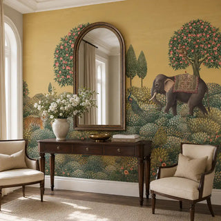 The Rajasi Van mustard wallpaper styled in a grand entryway behind an arched mirror and console table view-foyer
