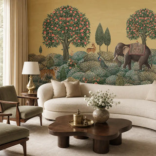 The Rajasi Van landscape mural styled behind a modern curved cream sofa in a luxury lounge setting view-livingroom